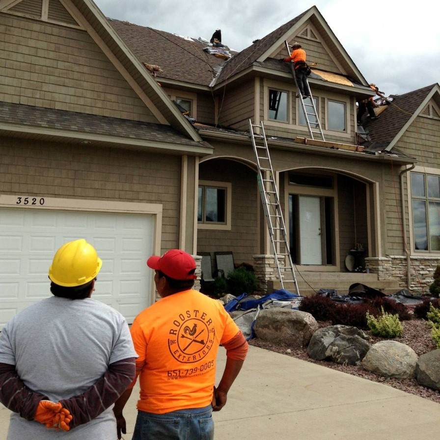 Side view of residential home with green vinyl siding