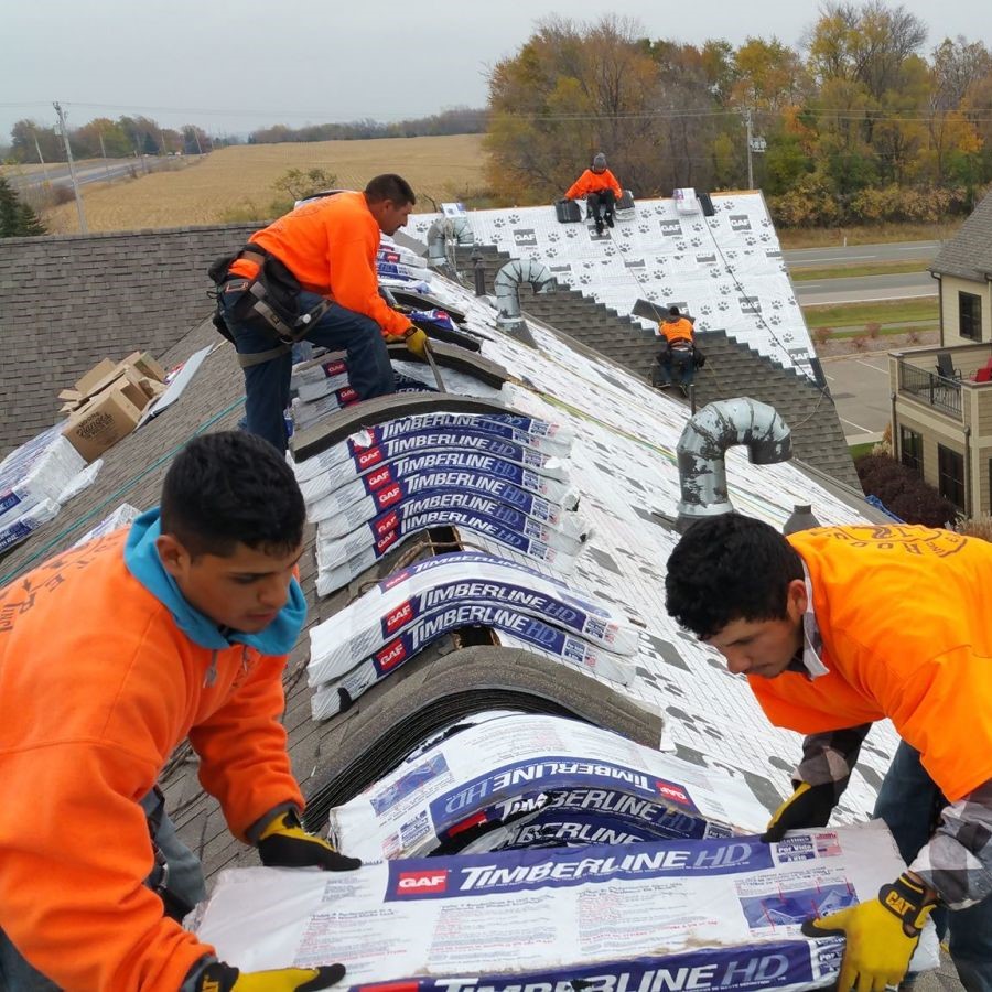 Arial view of commercial building with new ashpalt roof installed by Rooster Exteriors