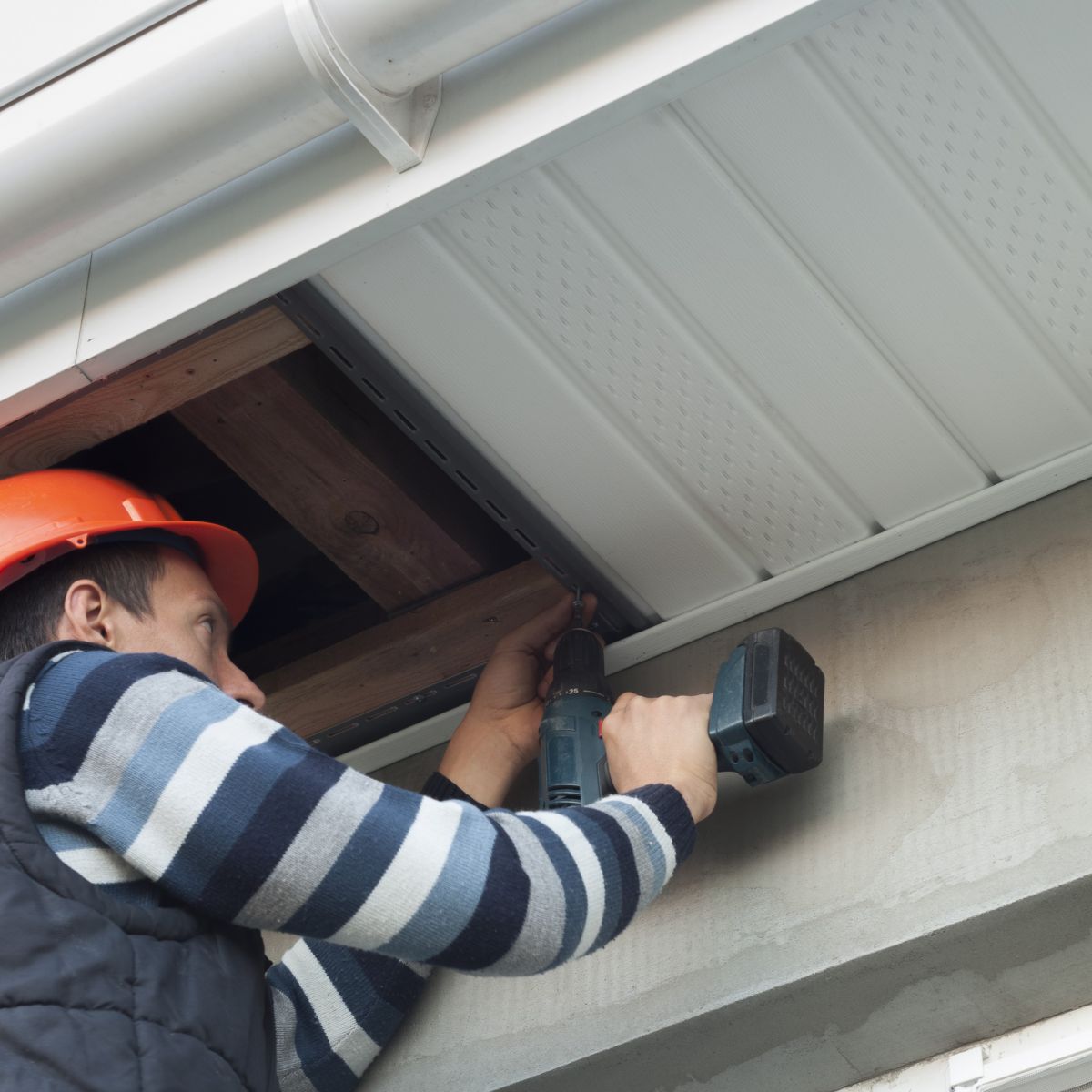 Bottom view of a soffit & fascia on a white residential home